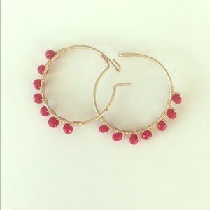Hoop earrings w red beads.